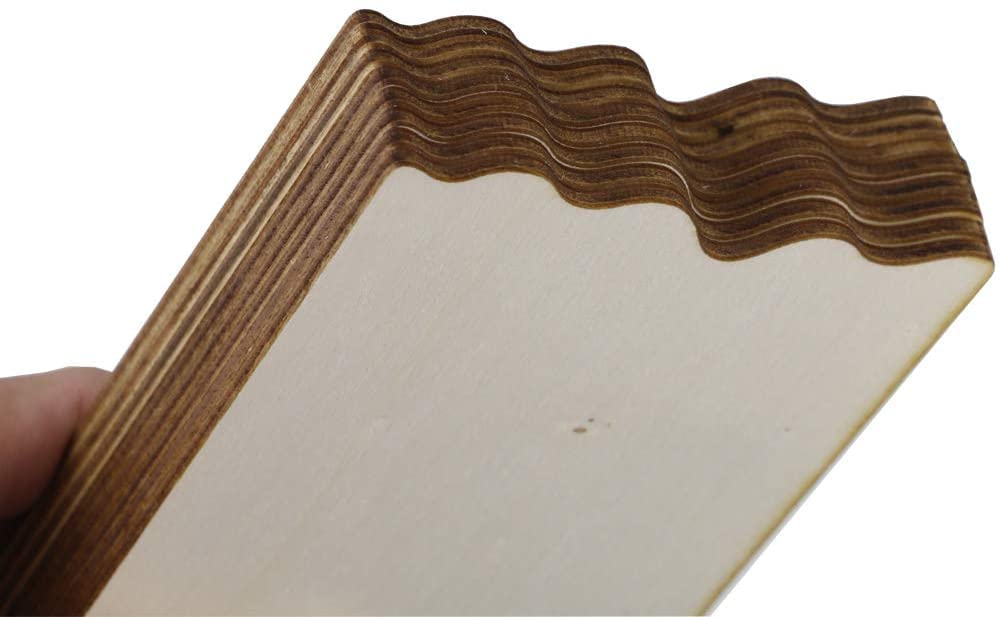 Wooden frame with wavy edge held by a hand on a white background