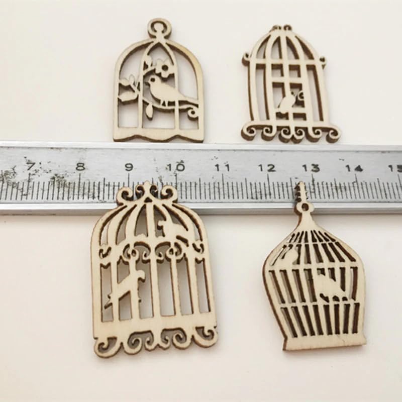 Four wooden birdcage-shaped decorations with a ruler for scale on a white background