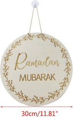 Round wooden sign with 'Ramadan Mubarak' text and decorative elements on a white background.