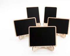 Set of five small blackboards with gold stands on a white background