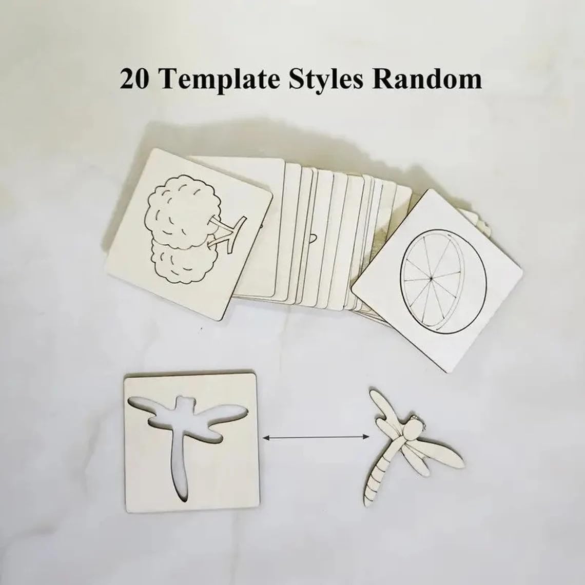 Set of cookie cutters with templates on a white surface