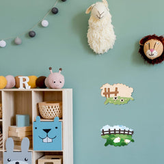 Children's room with animal-themed decor on a light blue wall.