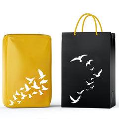 Yellow and black bags with bird designs on a white background