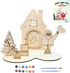 Wooden Christmas scene with Santa, tree, and house, including paint supplies on a white background.