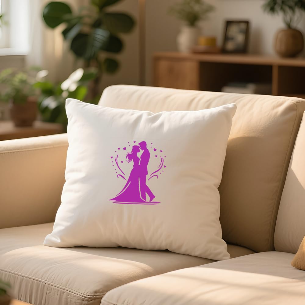 White pillow with a purple design of two people embracing on a beige couch in a living room.