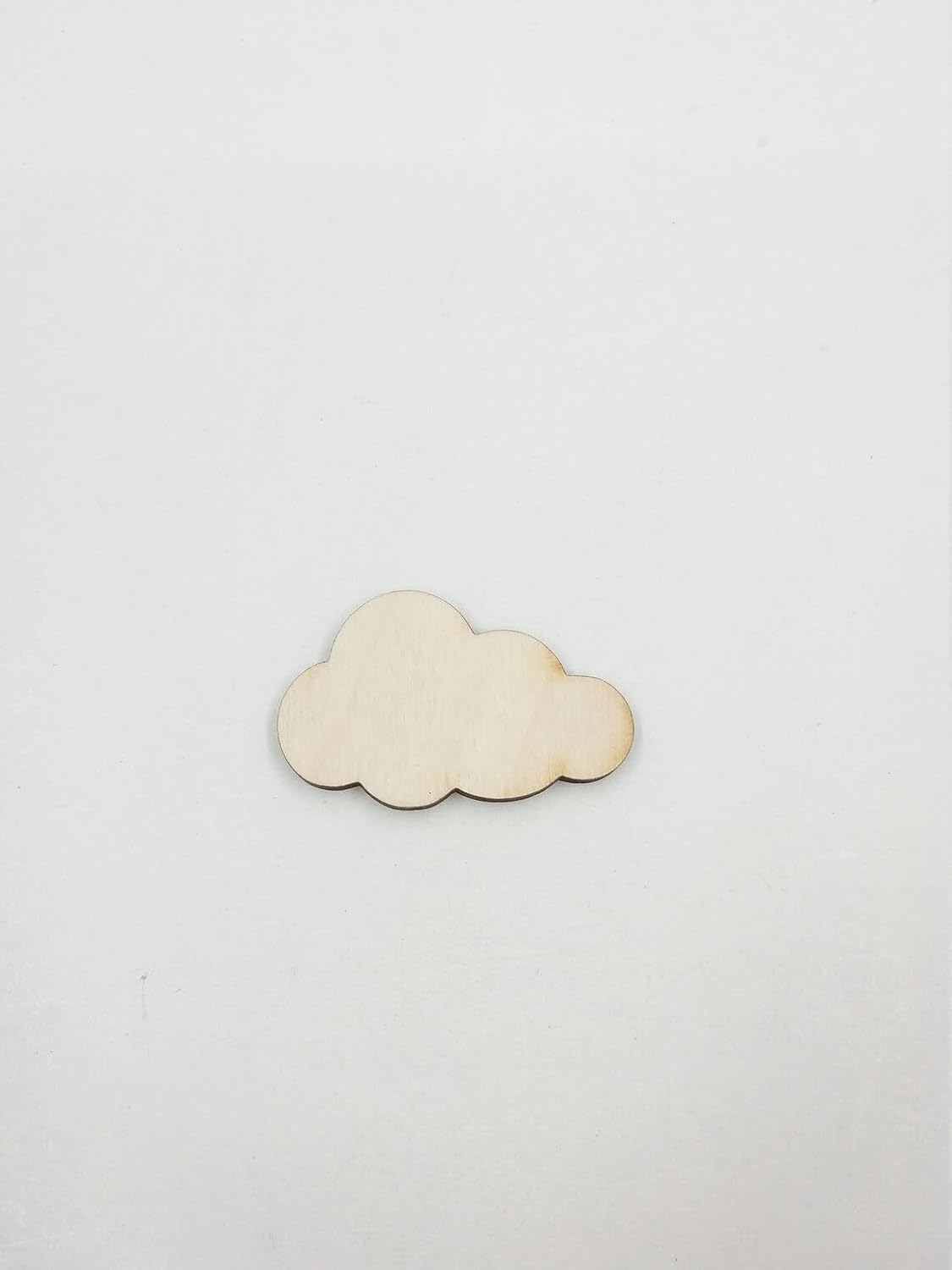 Wooden cloud-shaped object on a white background