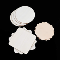 Set of white and beige round paper coasters on a black background
