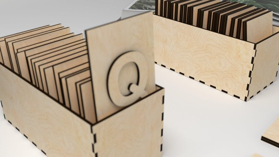 Wooden letter 'Q' cutout with a box on a white background