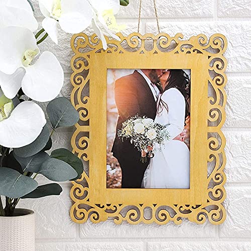 Decorative gold picture frame with a wedding photo of a couple, placed on a white textured surface with flowers.