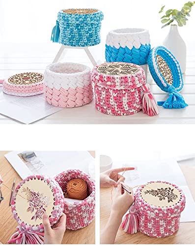 Decorative woven stools with tassels in various colors on a white surface.