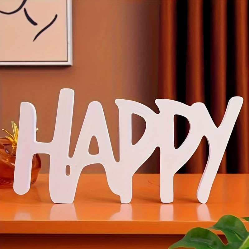 Wooden word 'HAPPY' on a wooden surface with a blurred background