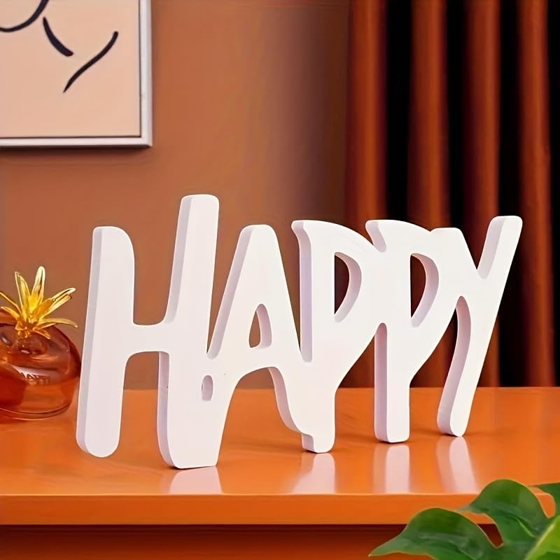Decorative word 'HAPPY' on a wooden surface with a warm background