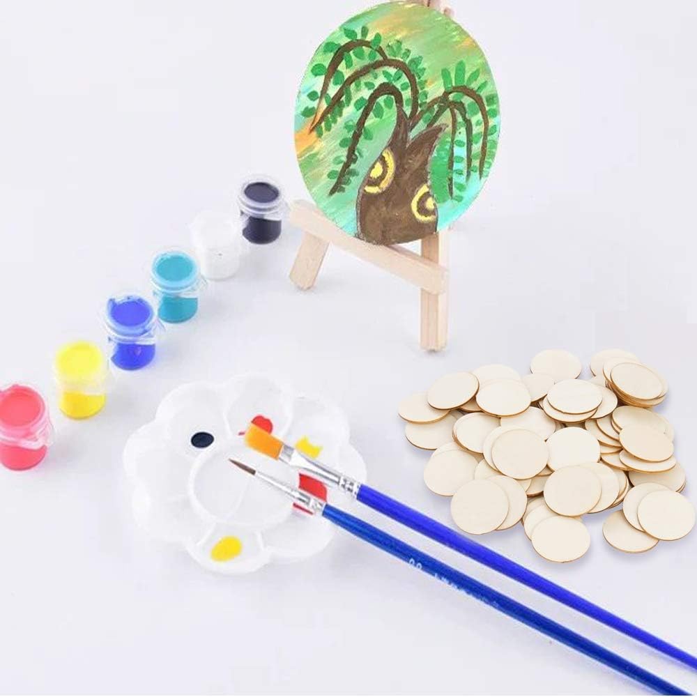 Art supplies including a small easel with a painted tree, paint jars, brushes, and gold coins on a white background.