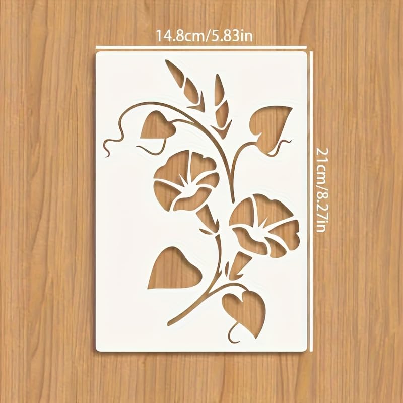 Floral design stencil with measurements on a wooden surface