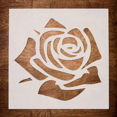 Wooden rose stencil on a wooden surface