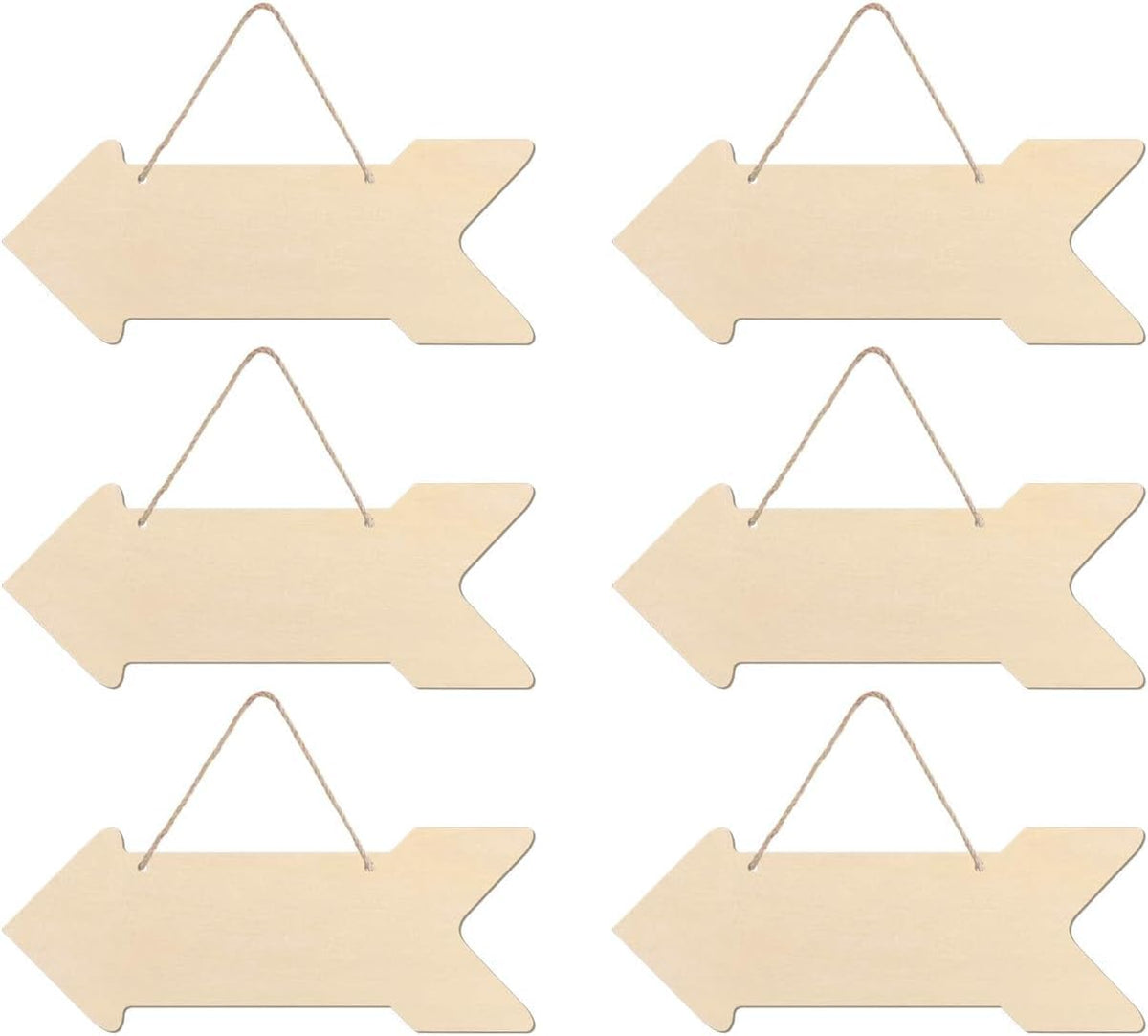 Set of six wooden arrow-shaped signs with hanging strings on a white background