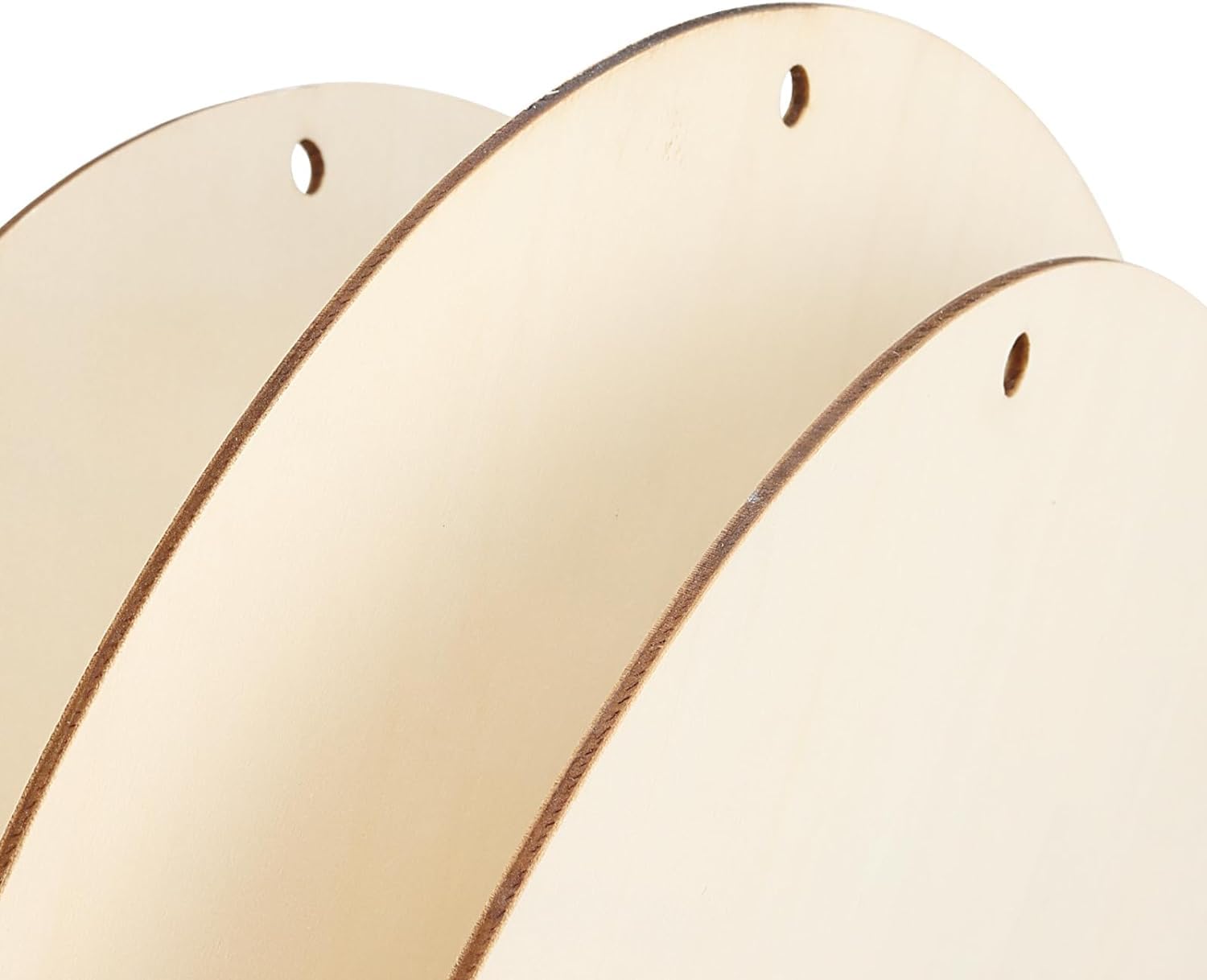 Close-up of beige hoop earrings on a white background