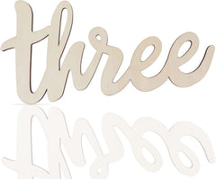Wooden number 'three' on a white background