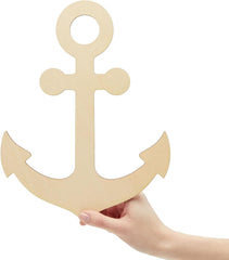 Wooden anchor shape held by a hand on a white background