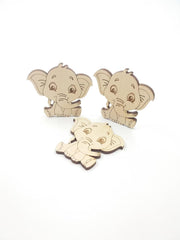 Three wooden elephant toys on a white background