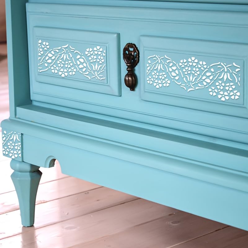Light blue wooden bench with decorative carvings on a wooden floor