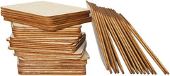 Stack of wooden boards and wooden sticks on a white background