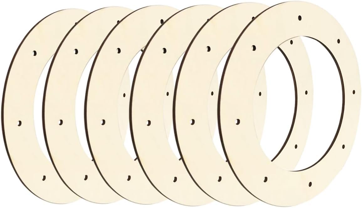 Four identical circular metal brake rotors with a beige finish.