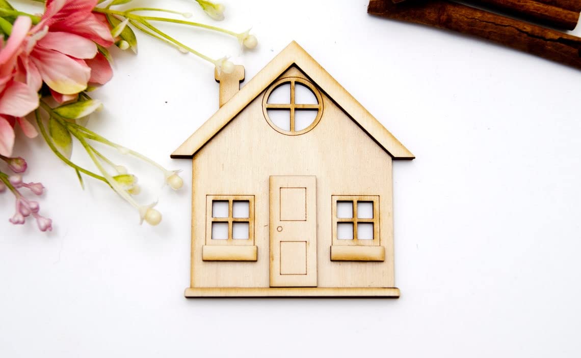 Wooden house model with flowers on a white background