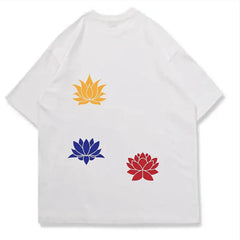 White t-shirt with yellow, blue, and red lotus flower designs on a white background