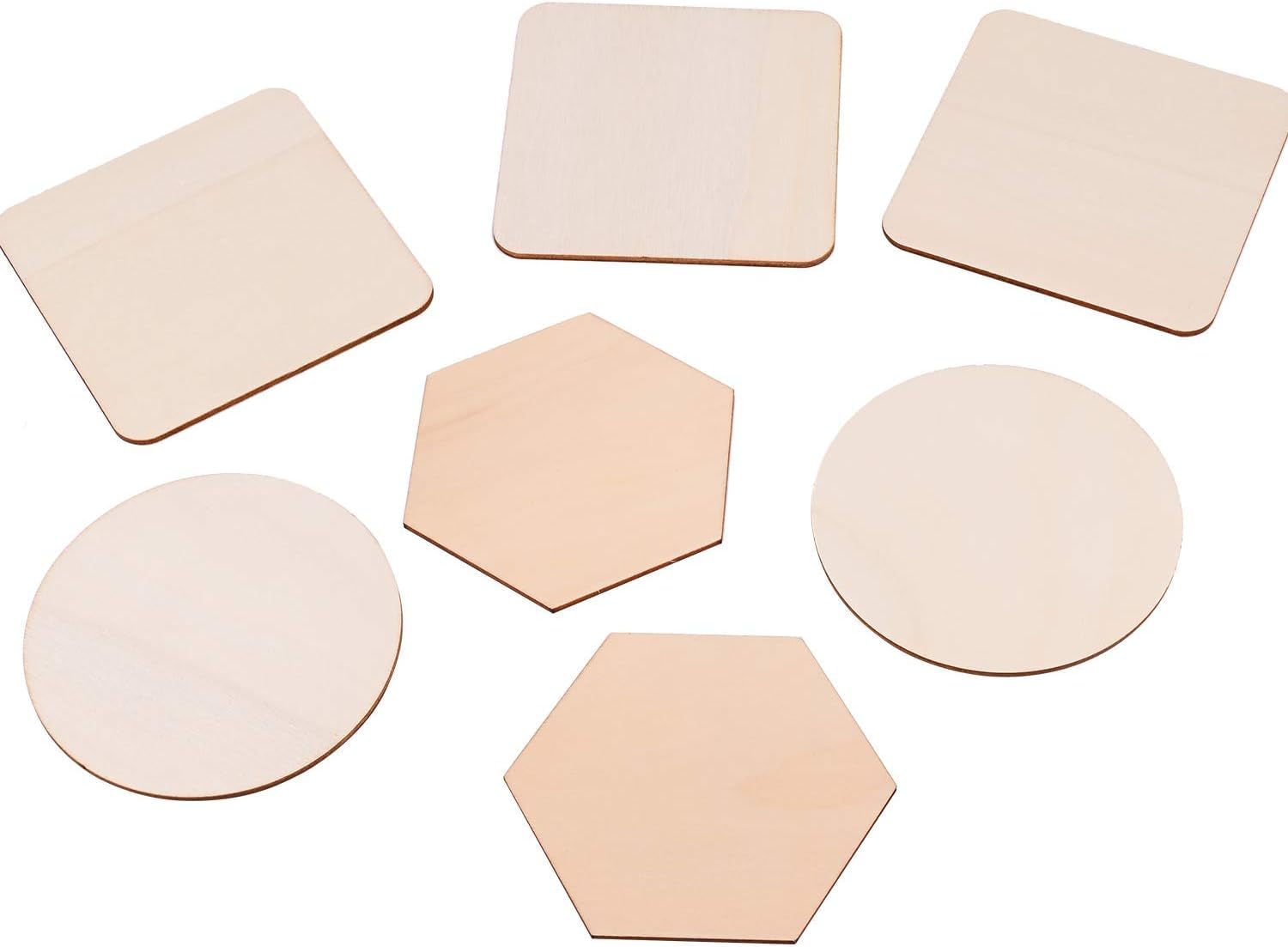 Set of various wooden coasters with different shapes on a white background