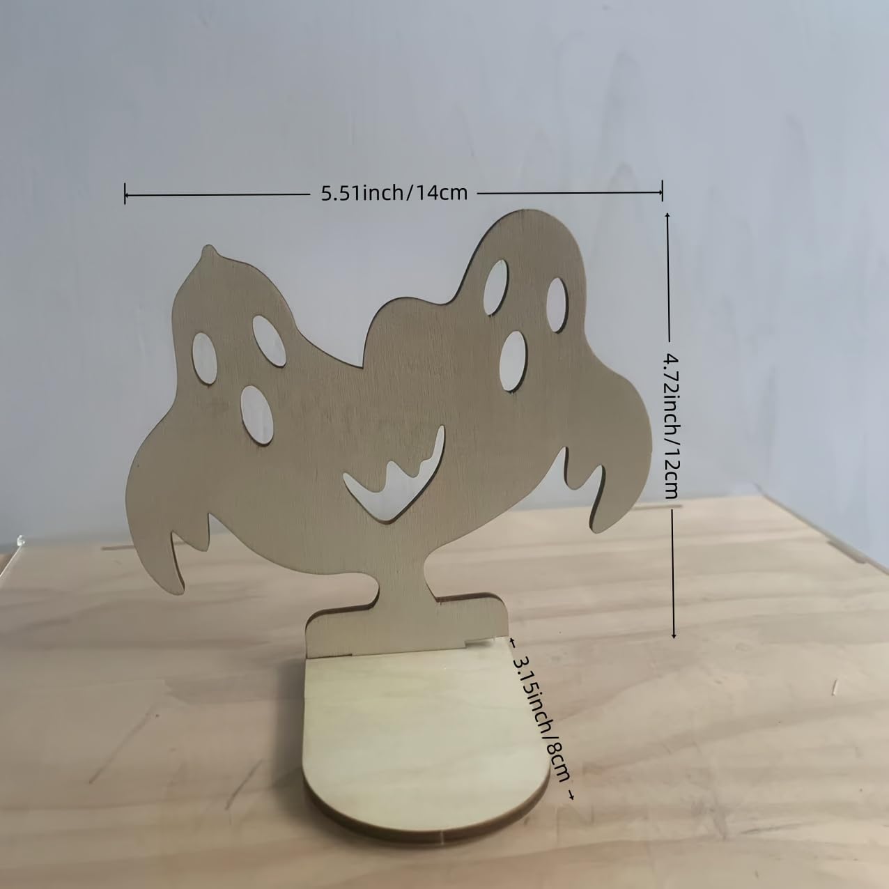 Wooden stand with measurements on a wooden surface