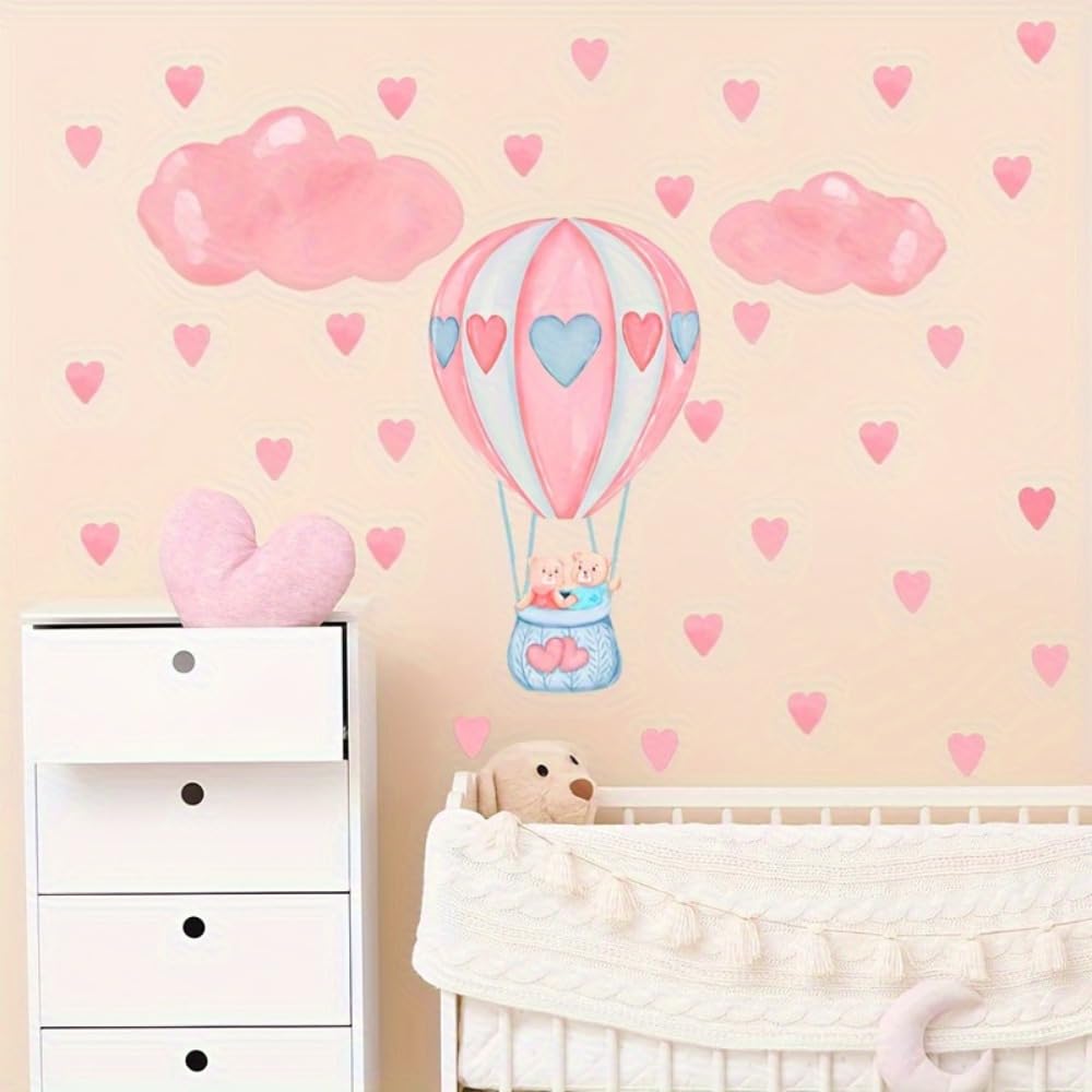 Children's room with pink hot air balloon wall decal, hearts, and a white dresser.