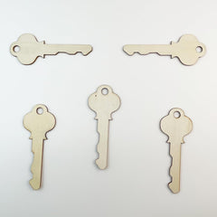 Five wooden key-shaped objects on a light gray background