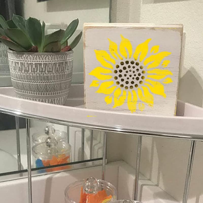 Decorative box with yellow sunflower design on a shelf with a potted plant.