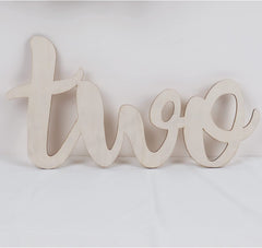 Wooden number 'two' on a white background
