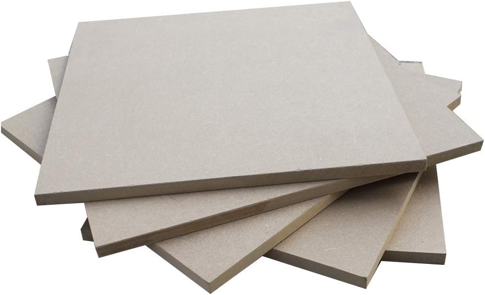 Stack of beige ceramic tiles on a white background