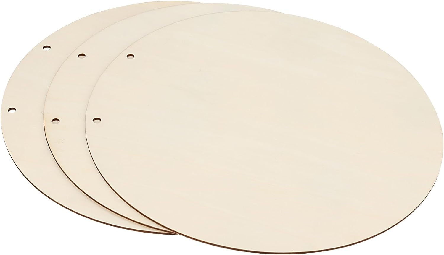 Three round wooden cutting boards with holes on a white background