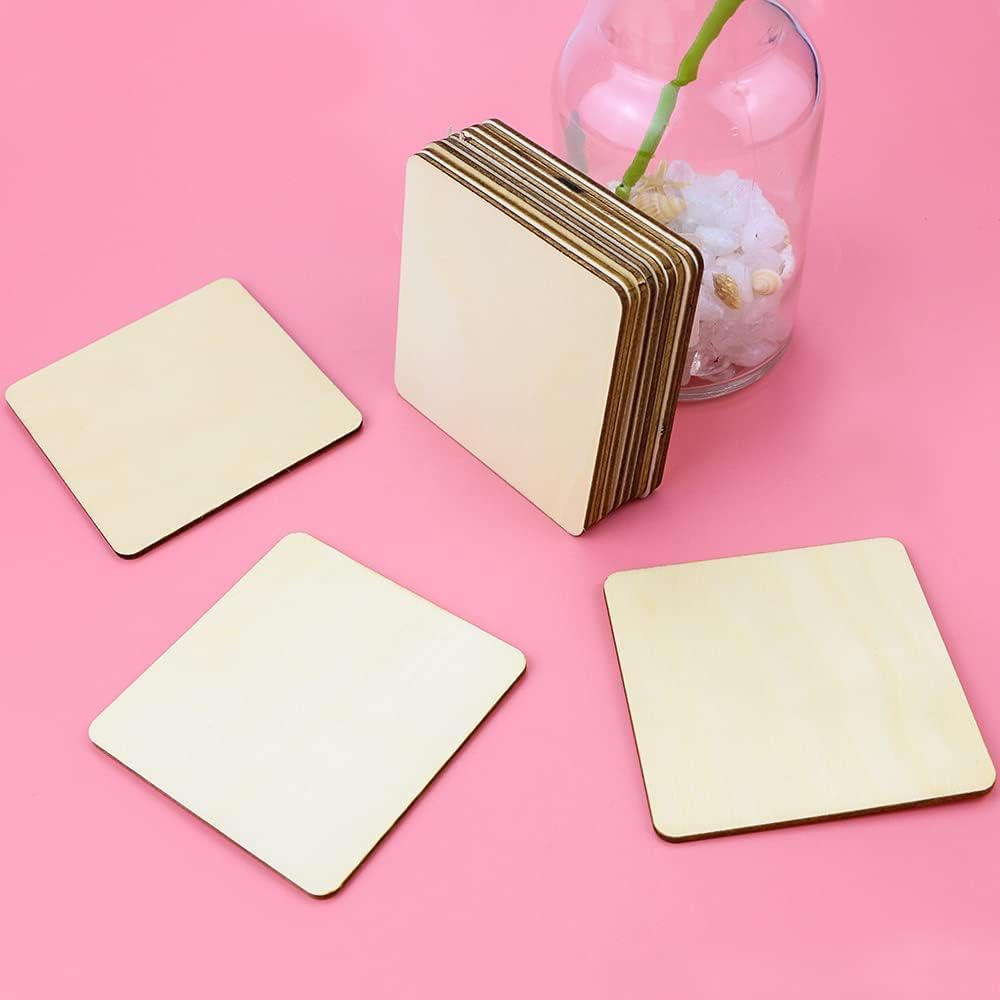 Set of square wooden coasters on a pink background with a vase.