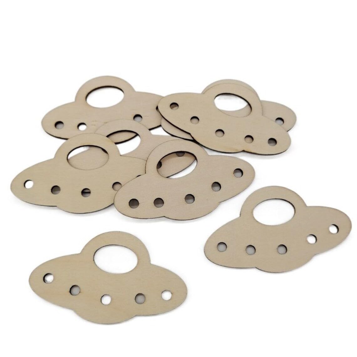 Set of beige metal gaskets on a white background