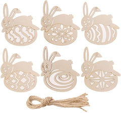 Set of wooden Easter bunny and egg decorations with jute string on a white background