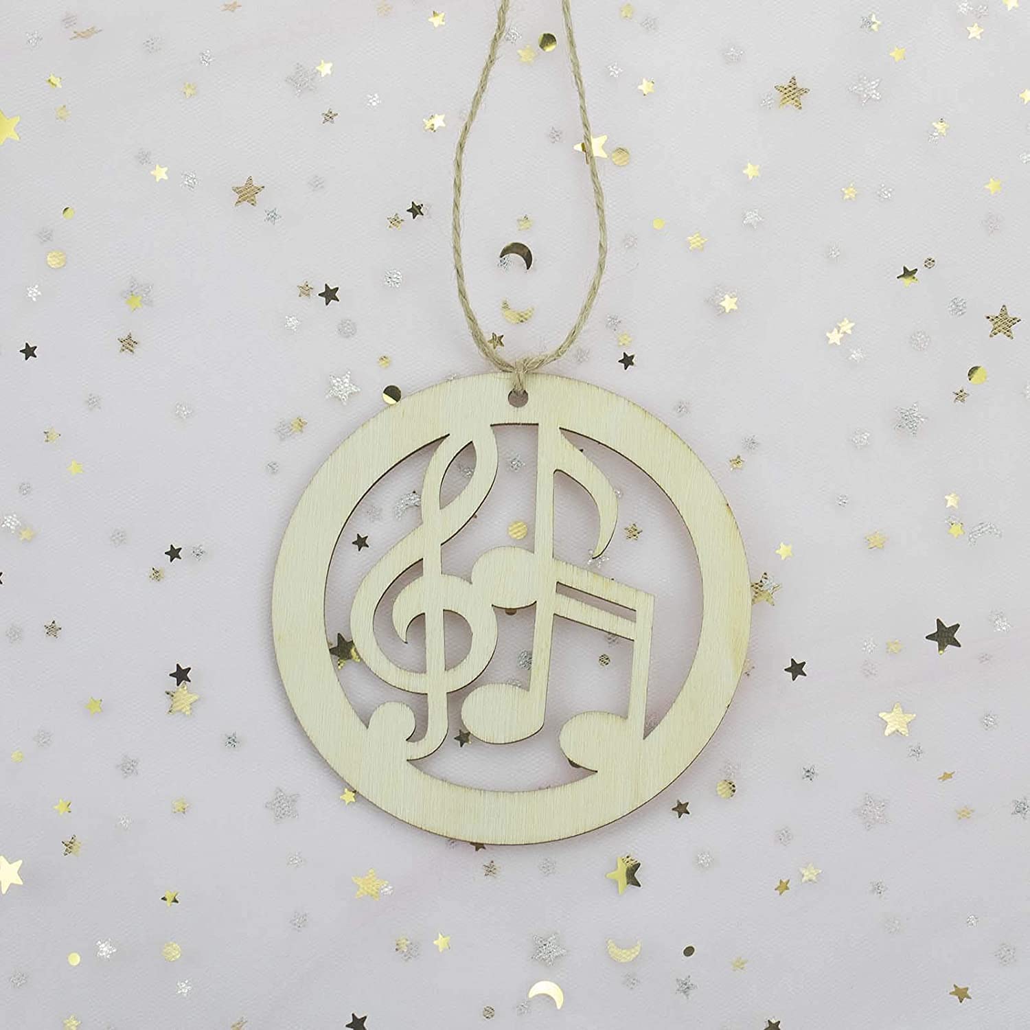 Decorative hanging ornament with music notes on a starry background
