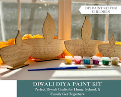 DIWali Diya paint kit with wooden diyas, paint, and brushes on a table.
