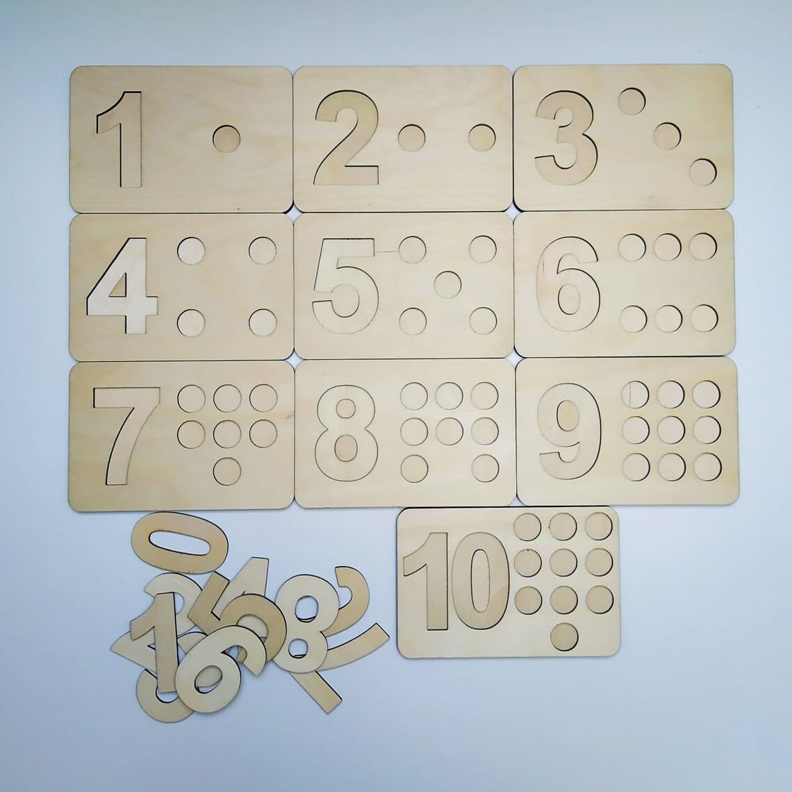 Set of wooden numbers on a light blue background