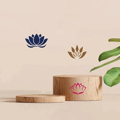 Wooden blocks with lotus flower designs on a beige background