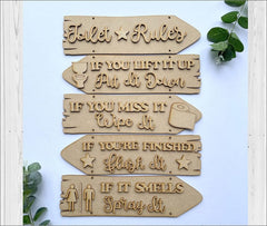 Set of wooden signs with humorous bathroom rules on a light blue background.