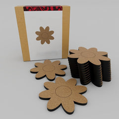 Flower-shaped coasters with cardboard backing on a white background