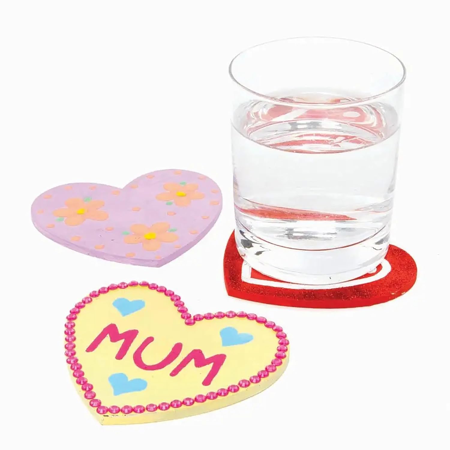 Heart-shaped coasters with floral design and 'MUM' text on a glass of water.