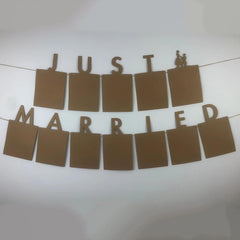 Decorative banner with 'Just Married' text on a white background