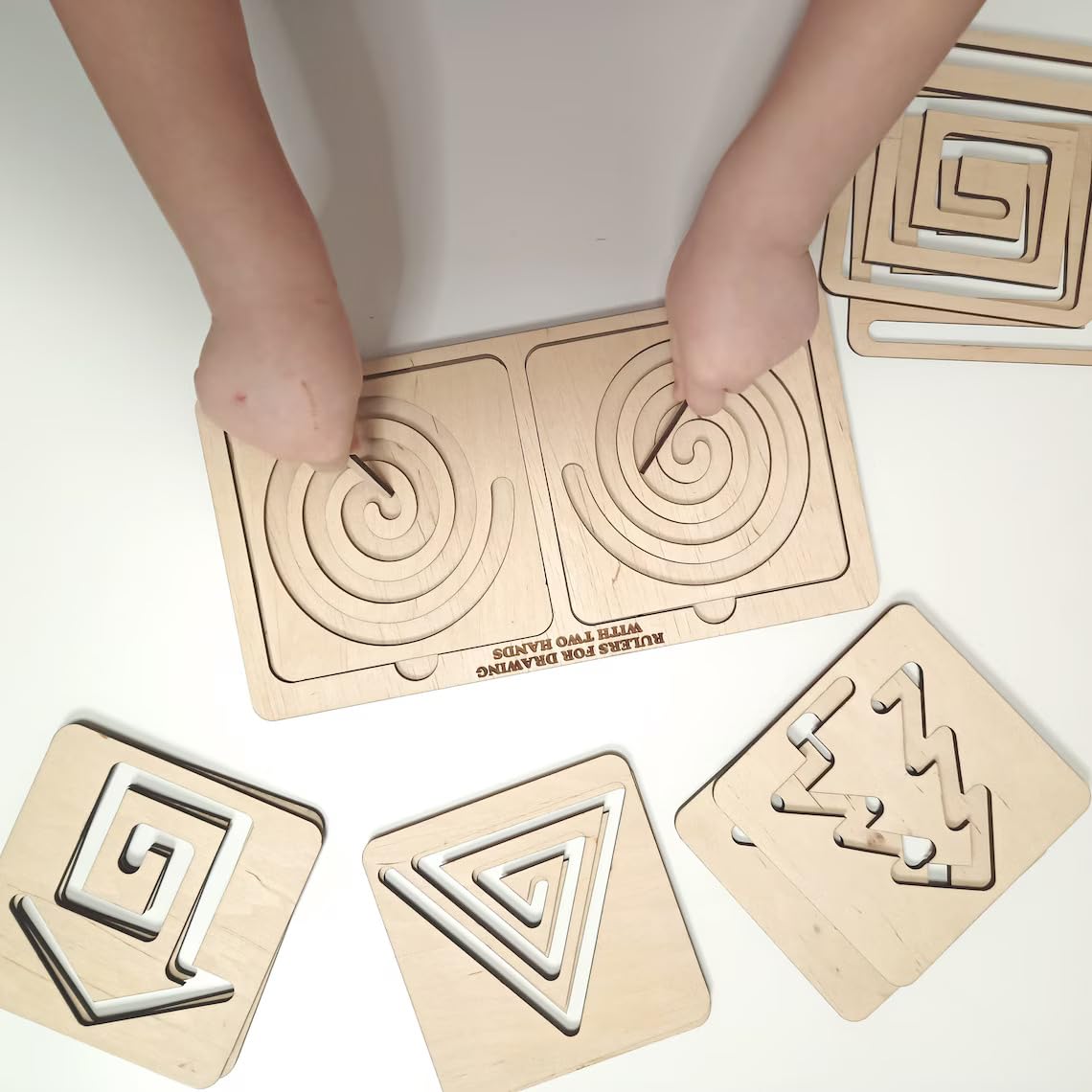 Wooden puzzle with geometric shapes on a white surface