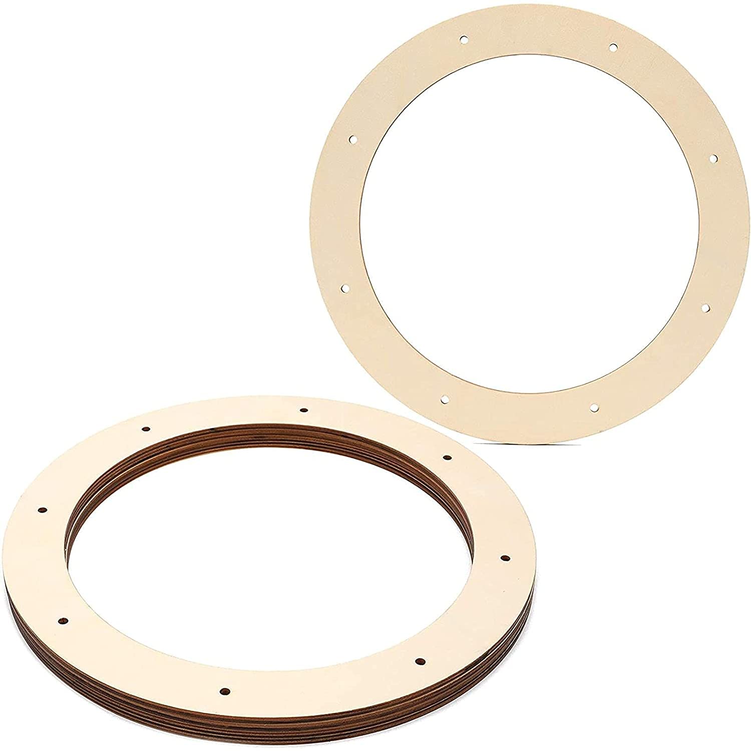 Two wooden rings with holes on a white background